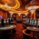 A luxurious casino interior with elegant gaming tables, slot machines, chandeliers, and a VIP lounge area with plush seating and champagne glasses, all in a sophisticated and vibrant atmosphere, no text or letters visible